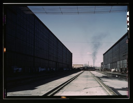 A completely overhauled engine on the transfer table at the Atchison, Topeka, and Santa Fe Railroad locomotive shops, Albuquerque, New Mexico. It is now ready to go into service