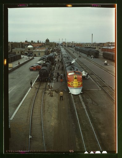 Santa Fe R.R. streamliner, the "Super Chief," being serviced at the depot, Albuquerque, N[ew] Mex[ico]. Servicing these diesel streamliners takes five minutes
