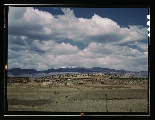 Indian houses and farms on the Laguna Indian reservation, Laguna N[ew] Mex[ico]. In the background is Mount Taylor. The Santa Fe R.R. crosses the reservation