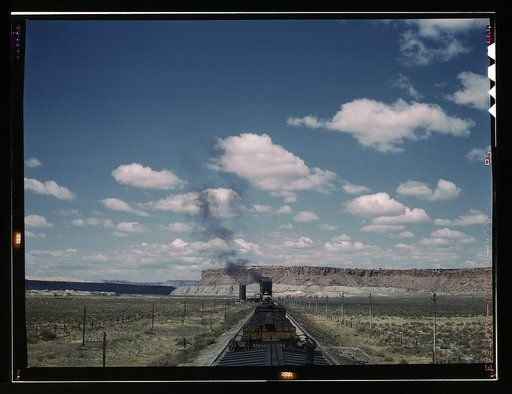 A freight train stopping for coal and water at a siding enroute to Gallup, New Mexico, near Laguna, N.M.