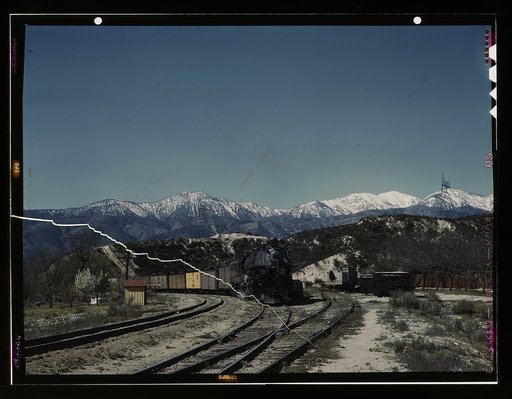 A east bound Union Pacific railroad freight train waiting in a siding, Alray, Calif. Coming up through Cajon Pass. The Santa Fe tracks are used by the Union Pacific as far east as Daggett, Calif. Santa Fe R.R. trip