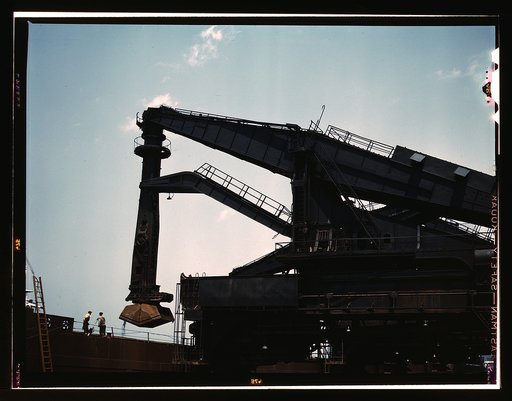 Pennsylvania R.R. ore docks, unloading ore from a lake freighter by "Hulett" unloaders, Cleveland, Ohio