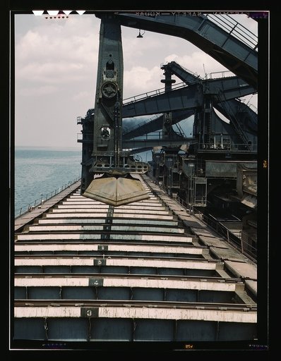 Pennsylvania R.R. iron ore docks, unloading ore from a lake freighter by means of "Hulett" ore unloaders