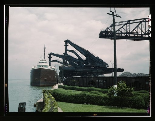 Pennsylvania R.R. [Railroad] ore docks, unloading iron ore from a lake freighter by means of "Hulett" unloaders, Cleveland, Ohio