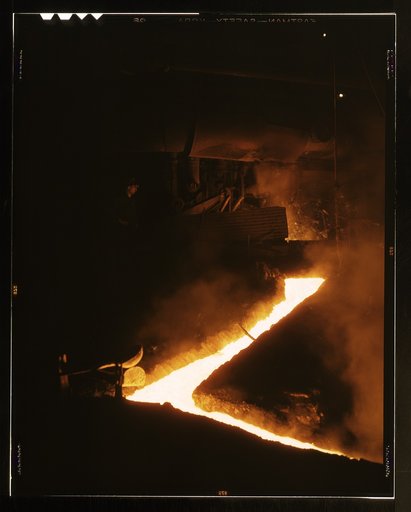 Slag run-off from one of the open hearth furnaces of a steel mills, Republic Steel Corp., Youngstown, Ohio. Slag is drawn off the furnace just before the molten steel is poured into ladles for ingotting