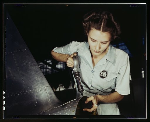 Answering the nation's need for womanpower, Mrs. Virginia Davis made arrangement for the care of her two children during the day and joined her husband at work in the Naval Air Base, Corpus Christi, Texas. Both are employed under Civil Service in the Assembly and repair department. Mrs. Davis' train