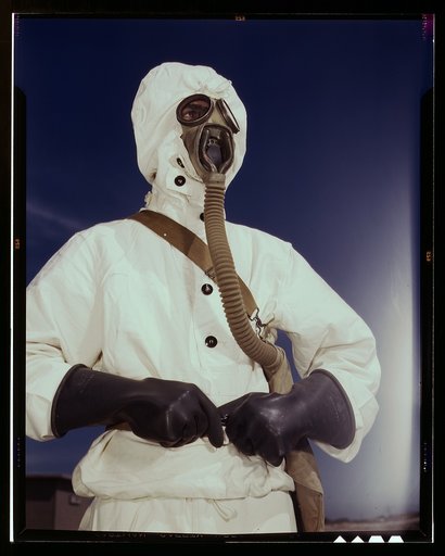 Sailor at the Naval Air Base wears the new type protective clothing and gas mask designed for use in chemical warfare, Corpus Christi, Texas. These uniforms are lighter than the old type