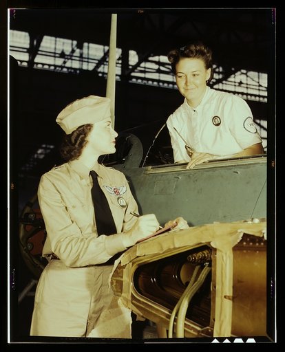 Formerly a sociology major at the University of Southern California, Mrs. Eloise J. Ellis (right) now "keeps 'em flyin'" at the Naval Air Base, Corpus Christi, Texas. She is a supervisor under civil service in the Assembly and Repair Department. It is her job to maintain morale among the women by he
