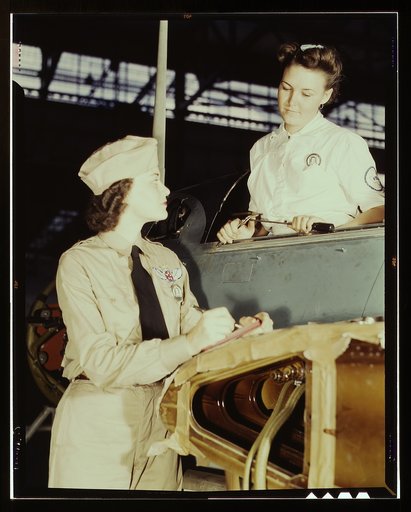 Formerly a sociology major at the University of Southern California, Mrs. Eloise J. Ellis (right) now "keeps 'em flyin'" at the Naval Air Base, Corpus Christi, Texas. She is a supervisor under civil service in the Assembly and Repair Department. It is her job to maintain morale among the women to he
