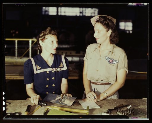 Pearl Harbor widows have gone into war work to carry on the fight with a personal vengeance, Corpus Christi, Texas. Mrs. Virginia Young (right) whose husband was one of the first casualties of World War II, is a supervisor in the Assembly and Repairs Department of the Naval Air Base. Her job is to f