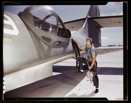 It's an intricate operation - installing a 30-calibre machine gun in a Navy PBY plane, but not too tricky for Jesse Rhodes Waller, Corpus Christi, Texas. He's a Georgia man who's been in the Navy 5-1/2 years. At the Naval Air Base he sees that the flying ships are kept in tip-top shape. Waller is an