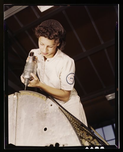 A rivet is her fighting weapon. Oyida Peaks, daughter of a Navy lieutenant, one of many women taking NYA training to become mechanics at the Naval Air Base, Corpus Christi, Texas. After eight weeks apprenticeship she will be qualified as a civil service worker in the Assembly and Repair Department