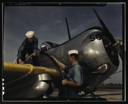 Feeding an SNC advanced training plane its essential supply of gasoline is done by sailor mechanics at the Naval Air Base, Corpus Christi, Texas