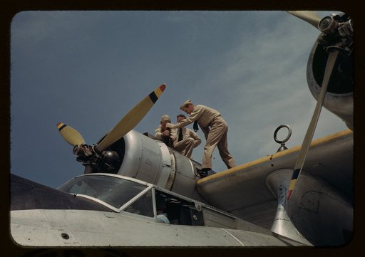 Working on a plane at the Naval Air Base, Corpus Christi, Texas