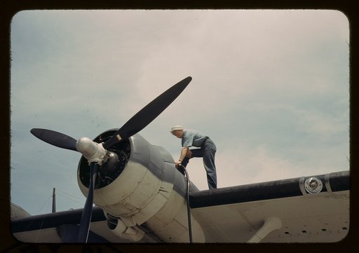 Sailor mechanic fueling a plane at the Naval Air Base, Corpus Christi, Texas