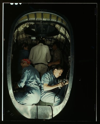 Working inside fuselage of a Liberator Bomber, Consolidated Aircraft Corp., Fort Worth, Texas