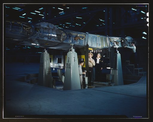 Working on wing of Consolidated Liberator Bomber, Consolidated Aircraft Corp. plant, Fort Worth, Texas