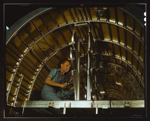 Production of B-24 bombers and C-87 transports, Consolidated Aircraft Corp., Fort Worth, Texas. Cabbie Coleman, former housewife, works at western aircraft plant. Installing of oxygen racks above the flight deck