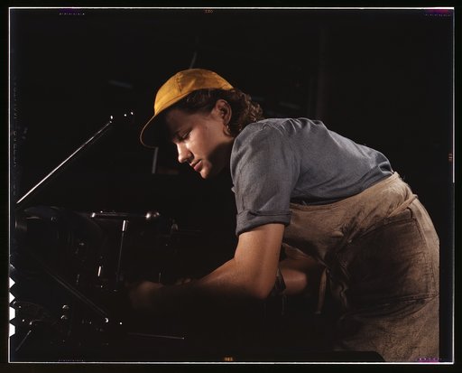 A lathe operator machining parts for transport planes at the Consolidated Aircraft Corporation plant, Fort Worth, Texas