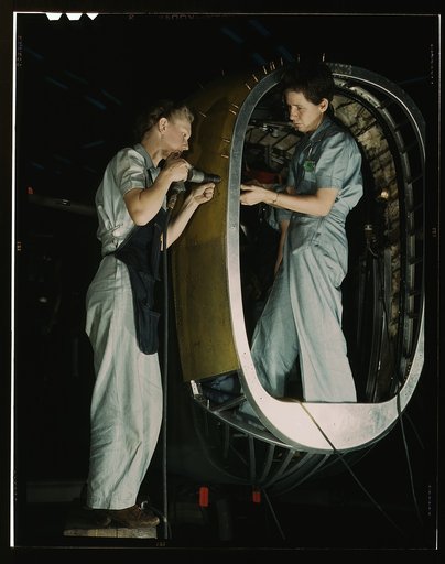 Frances Eggleston, aged 23, came from Oklahoma, used to do office work. Removing paper from pilot's window(?), Consolidated Aircraft Corp., Fort Worth, Texas
