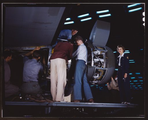 Installing an engine at the Consolidated Aircraft Corporation plant, Fort Worth, Texas