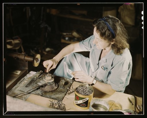 Transfusion donor bottles, Baxter Lab., Glenview, Ill. Formerly a sculptress and designer of tiles, Dorothy Cole converted her basement into a workshop to tin plate needles for valves for blood transfusion bottles prepared by Baxter Laboratories where she lives. She turns in her profits to war bonds