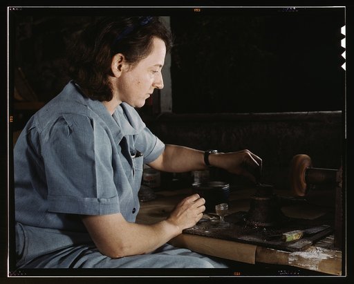 Transfusion donor bottles, Baxter Lab., Glenview, Ill. Formerly a sculptress and designer of tiles, Dorothy Cole converted her basement into a workshop to tin plate needles for valves for blood transfusion bottles prepared by Baxter Laboratories where she lives. She turns in her profits to war bonds