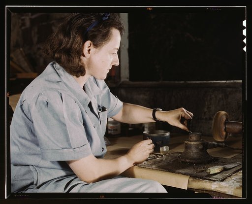 Transfusion donor bottles, Baxter Lab., Glenview, Ill. Formerly a sculptress and designer of tiles, Dorothy Cole converted her basement into a workshop to tin plate needles for valves for blood transfusion bottles prepared by Baxter Laboratories where she lives. She turns in her profits to war bonds