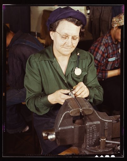 War production worker at the Vilter [Manufacturing] Company making M5 and M7 guns for the U.S. Army, Milwaukee, Wis. Ex-housewife, age 49, now doing bench work on small gun parts. Son [is] Second L[ieutenan]t, Son-in-law, Capt[ain] in Army