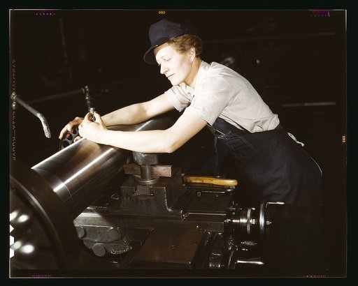 War production workers at the Vilter [Manufacturing] Company making M5 and M7 guns for the U.S. Army, Milwaukee, Wis. Ex-stage orchestra musician, checking an M7 gun with gage, after turning out on a gun lathe. Her two brothers and husband are in the service