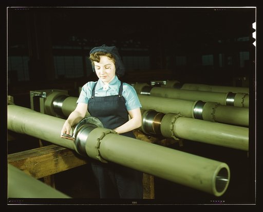 Gist inspector, Mrs. Mary Betchner inspecting one of the 25 cutters for burrs before inserting it in the inside of a 105mm. howitzer at the Milwaukee, Wis. plant of the Chain Belt Co. Her son is in the army; her husband is in war work