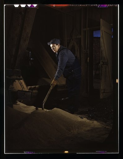 Chicago and North Western R.R., Mrs. Thelma Cuvage, working in the sand house at the roundhouse, Clinton, Iowa. Her job is to see that sand is sifted and cleaned for use in the locomotives. Mrs. Cuvage's husband works as a guard at the Savannah (Ill.) Ordnance plant