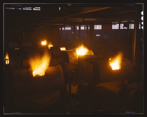 A battery of 1,000 and 2,000 pound furnaces roaring threats to the Axis. These are rotary, oil-fired melting furnaces at Aluminum Industries Inc. Destination of the finished aluminum products is kept secret
