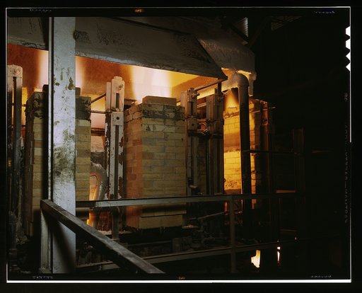 Owens-Corning Fiberglas Corporation, Toledo, Ohio. Side view of a glass furnace melting the carefully compounded batch required for the production of Fiberglas thermal insulation being installed in the hulls of naval vessels now under construction