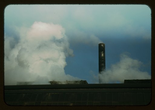 Busy stacks give evidence of all-out war production effort at a plant of Owens-Corning Fiberglass Corporation, Akron, Ohio