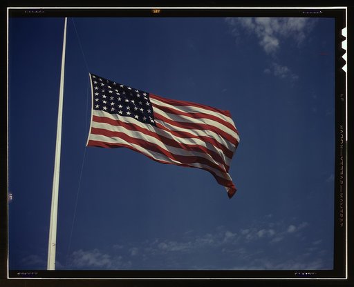 High above, over a true "home of the brave," the floating folds of the Star Spangled Banner symbolize the American way of life to soldiers in training for the battles that will bring freedom to an unhappy, wartorn world, Fort Knox, Ky.