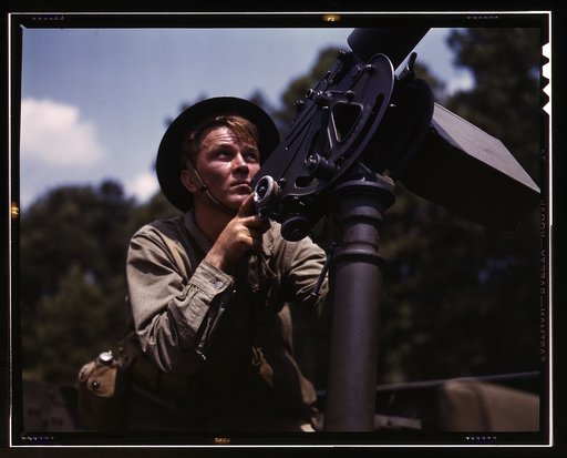 Good man, good gun: a private of the armored forces does some practice shooting with a 30-calibre Browning machine gun, Fort Knox, Ky. The gun is mounted on a pedestal for anti-aircraft work
