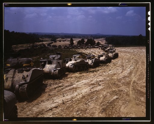 Parade of M-4 (General Sherman) and M-3 (General Grant) tanks in training maneuvers, Ft. Knox, Ky. Note the lower design of the M-4, the larger gun in the turret and the two hatches in front of the turret