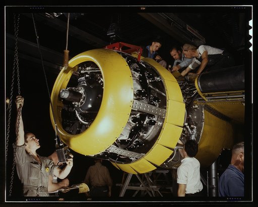 Mounting motor [on a] Fairfax B-25 bomber, at North American Aviation, Inc., plant in [Inglewood], Calif.