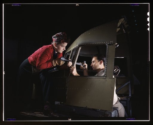 Riveting team working on the cockpit shell of a B-25 [i.e. C-47] bomber at the plant of North American Aviation, Inc., Inglewood [i.e. Douglas Aircraft Company, Long Beach], Calif.
