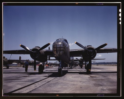 B-25 bombers on the outdoor assembly line at North American Aviation, Incorporated, almost ready for their first test flight, Kansas City, Kansas