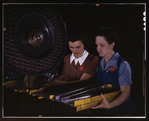 Punching rivet holes in a frame member for a B-25 bomber, the plant of North American Aviation, Inc., Calif.