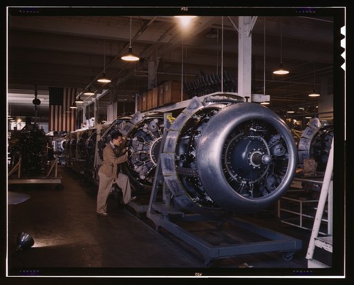 Cowling and control rods are added to motors for North American B-25 bombers as they move down the assembly line, North American, Inc., Inglewood, Calif.
