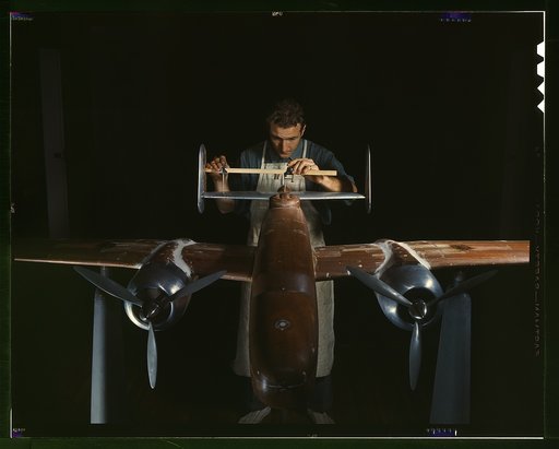 An experimental scale model of the B-25 plane is prepared for wind tunnel tests in the plant of North American Aviation, Inc., Inglewood, Calif. This plant produced the B-25 bomber