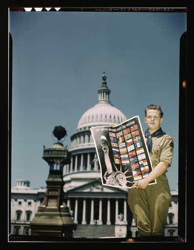United Nations Fight for Freedom: Boy Scout in front of Capitol. They help out by delivering posters to help the war effort