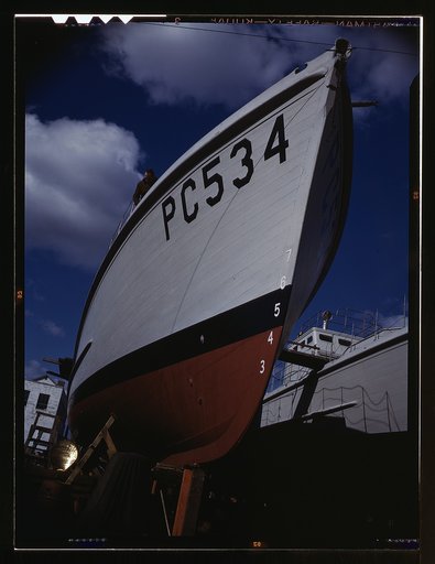 Another harrier of the U-boats nears completion at an eastern boat yard, Marine Construction Co., Stamford, Conn. Many new 110-foot wooden sub-chasers are taking the water these days at yards in all parts of the country