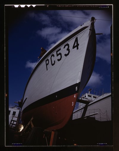 Another harrier of the U-boats nears completion at an eastern boat yard, Marine Construction Co., Stamford, Conn. Many new 110-foot wooden sub-chasers are taking the water these days at yards in all parts of the country