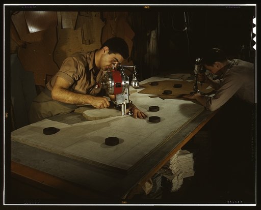 The utmost precision is required of these operators who are cutting and drilling parachute packs in an eastern factory, Manchester, Conn. Their work is under constant close supervision. Pioneer Parchute Company