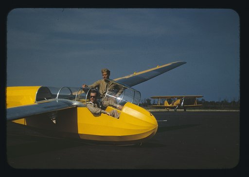 Marine lieutenant, glider pilot in training, ready for take-off at Page Field, Parris Island, S.C. Power towing plane in background