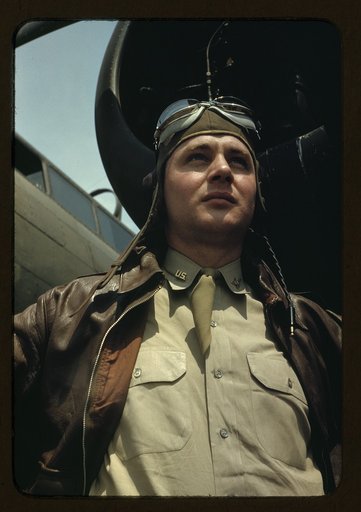 U.S. Army Air Forces pilot in front of a YB-17 bombing airplane, probably Langley field, Virginia